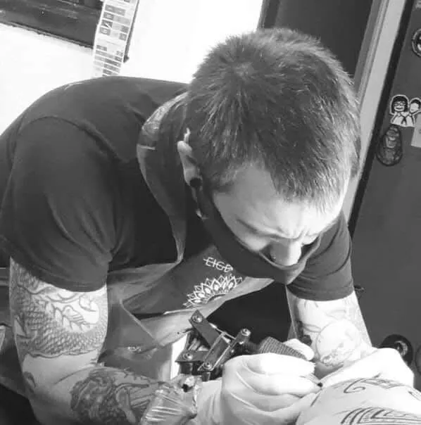 TitchTattoo artist at work