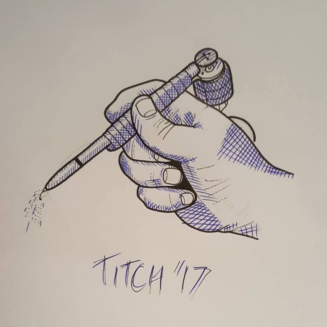 Blue ink sketch of a hand holding a tattoo machine